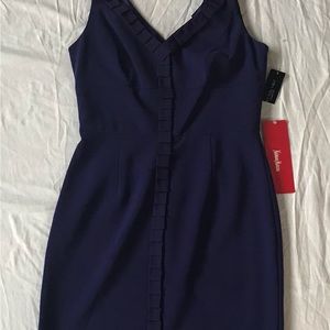 Crepe fully lined V-Neck with design around neck line and front. VERY ELEGANT